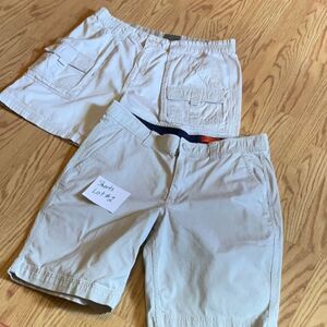 LOT OF 2 pair of light colored mens shorts in waist size 34”